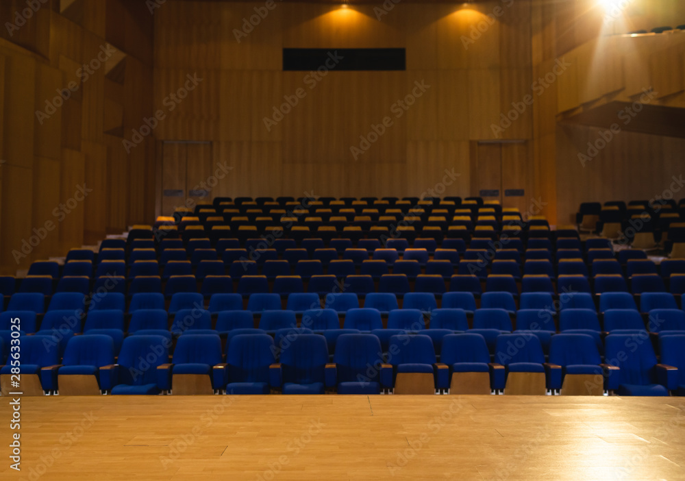 Naklejka premium Auditorium with all lights on with blue chair around