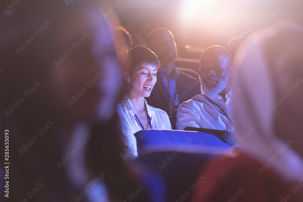 Business colleague sitting and interacting with each other in the auditorium Business colleague sitting and interacting with each other in the auditorium
