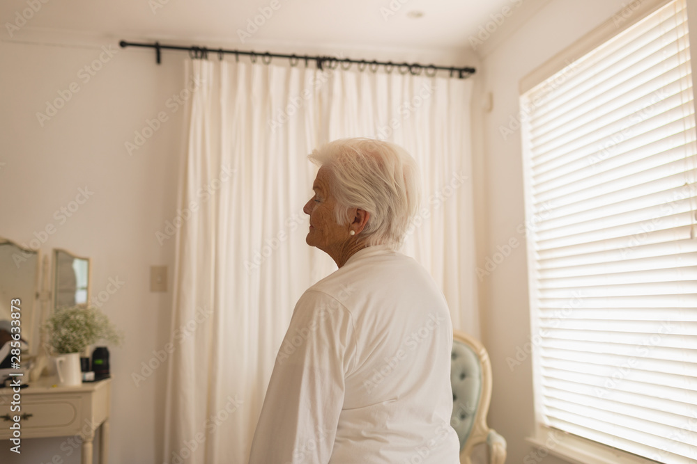 Senior woman relaxing in bedroom Senior woman relaxing in bedroom