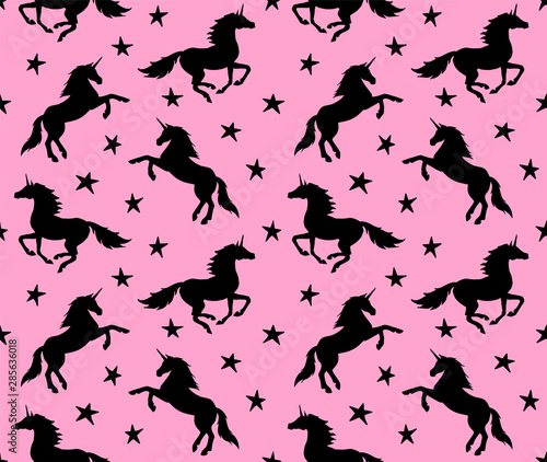 Vector seamless pattern of black unicorn silhouette isolated on pink background