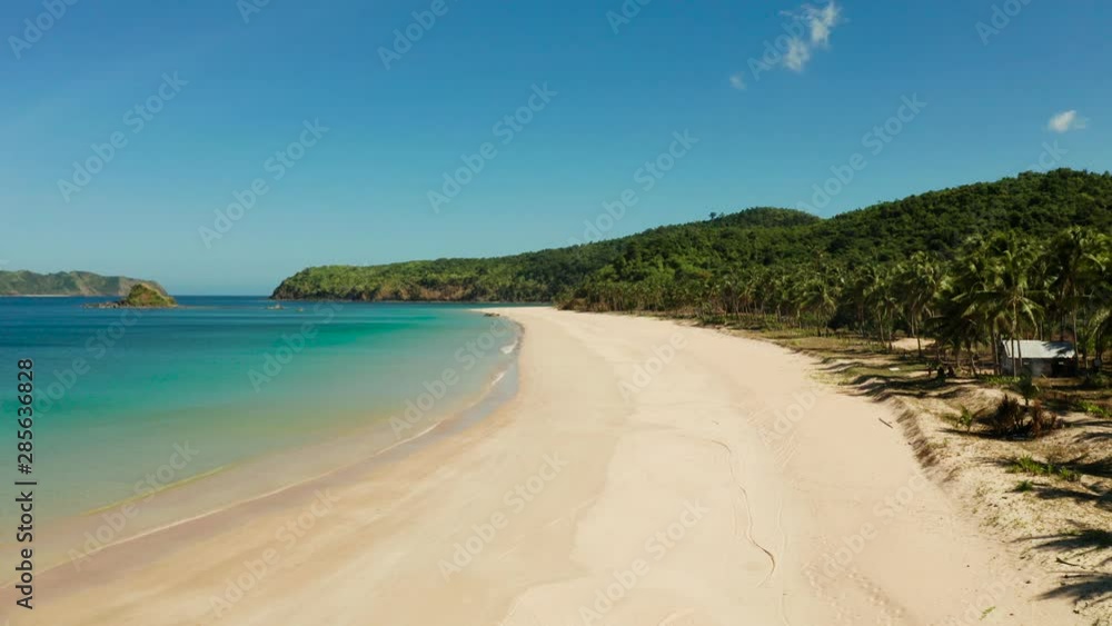 Aerial drone of tropical sandy beach and blue water. Nacpan, El Nido, Palawan, Philippines. Seascape with tropical beach and islands. Summer and travel vacation concept Aerial drone of tropical sandy beach and blue water. Nacpan, El Nido, Palawan, Philippines. Seascape with tropical beach and islands. Summer and travel vacation concept