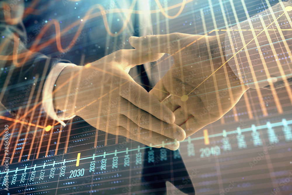 Multi exposure of forex graph on abstract background with two businessmen handshake. Concept of success on stock market Multi exposure of forex graph on abstract background with two businessmen handshake. Concept of success on stock market