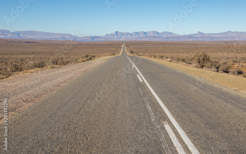 The N12 highway runs in places through the arid Klein Karoo region of South Africa image in landscape format with copy space