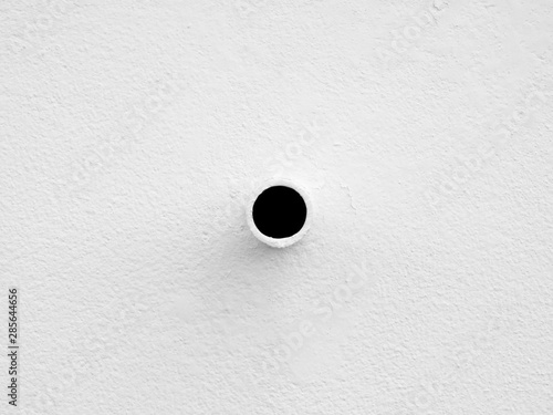 hole of pipe on white wall background, minimalism style