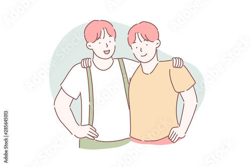 Brotherhood, friendship, partnership concept. Two twin brothers embrace each other. Guys are friends standing together.