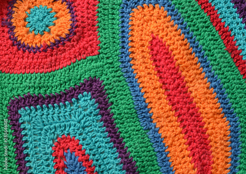 Free form knitting crocheting texture background with cotton yarn of bright colors