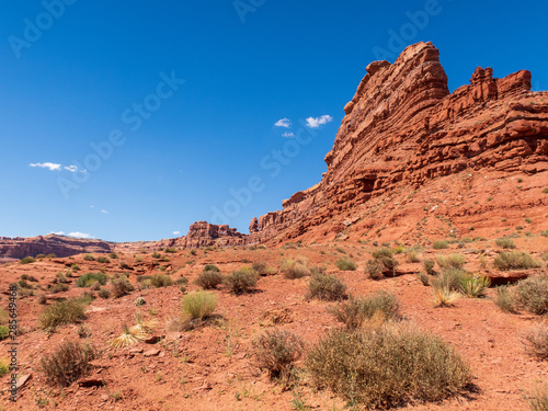 Low angle landscape of orange stone buttes in Valley of the Gods in Utah