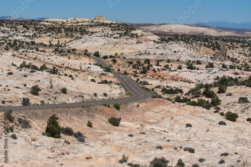 Scenic Byway 12 in Utah landscape of road leading through a valley of white stone