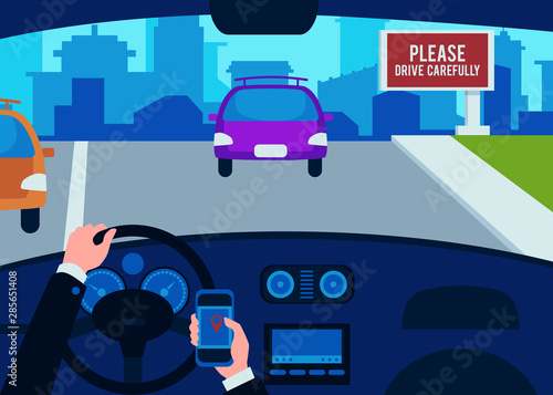 The interior of the car inside, the drivers hands of a man on the steering wheel with a phone.