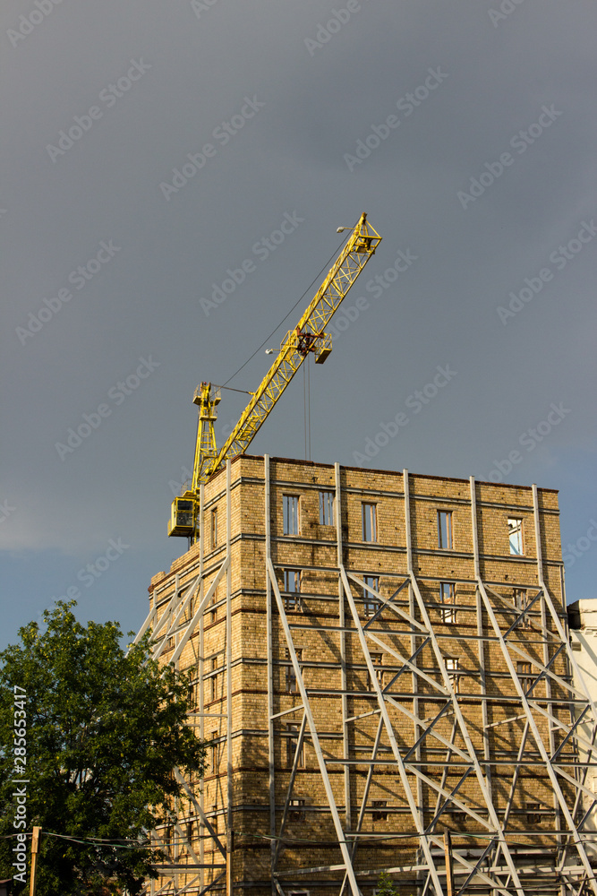 Fototapeta premium Restoration of an old building. Gentrification of the area. Side view