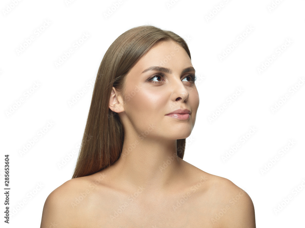 Portrait of beautiful young woman isolated on white studio background. Caucasian female model looking at side and posing. Concept of women's health and beauty, self-care, body and skin care. Portrait of beautiful young woman isolated on white studio background. Caucasian female model looking at side and posing. Concept of women's health and beauty, self-care, body and skin care.