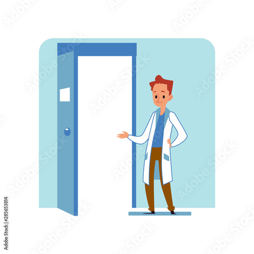 Redhead caucasian male doctor or veterinarian in a hospital or veterinary clinic stands at the door