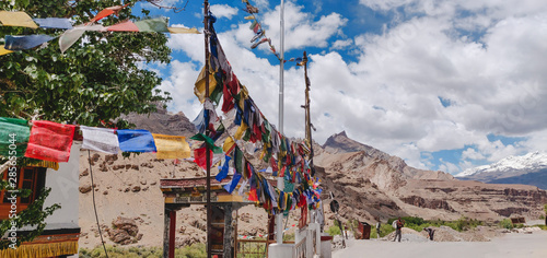 Colorful Buddhist flags all over the place at Ladakh region of India. photo