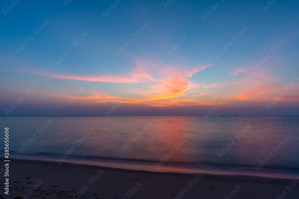 Pink and purple morning sky on a beach in Qatar