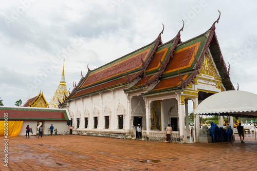 Thai people make a merit inside Wat Phra Borommathat Chaiya in Chaiya in Surat Thani, Thailand.