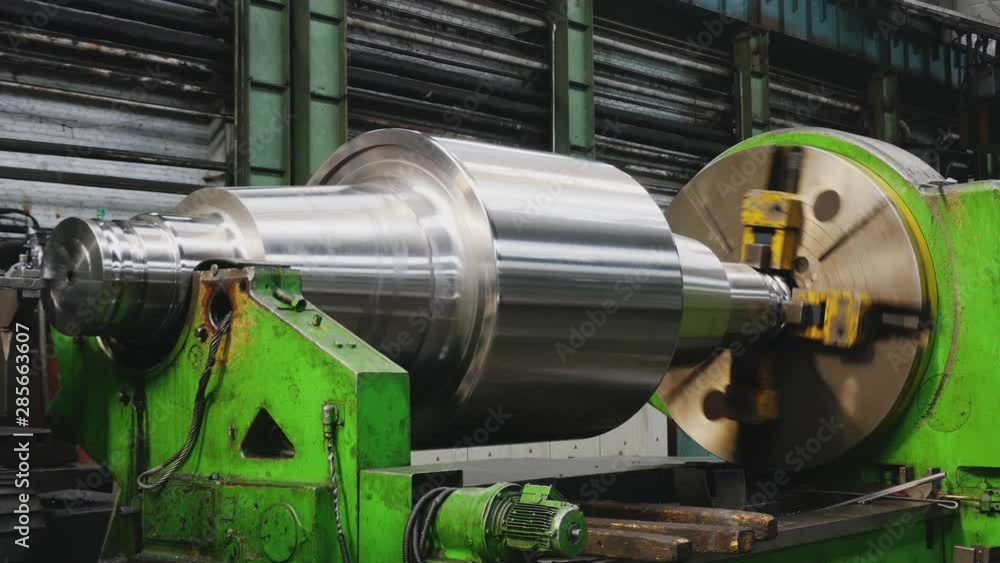 Big roll are created on the metal rolling machine at the plant. Creation of profiles, machine for creation of rolls from steel sheet. Rolling mill preparation workshop. Machining of machine parts. Big roll are created on the metal rolling machine at the plant. Creation of profiles, machine for creation of rolls from steel sheet. Rolling mill preparation workshop. Machining of machine parts.