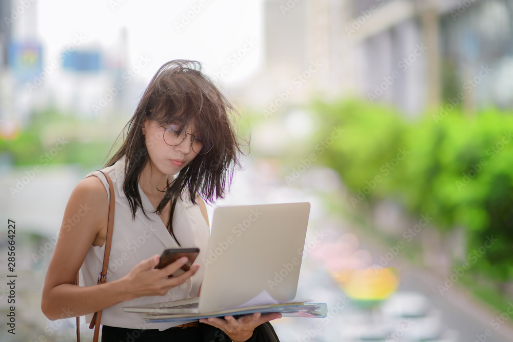 business woman busy and working complicate or occupied on street of city traffic, serious working at all time working business woman busy and working complicate or occupied on street of city traffic, serious working at all time working