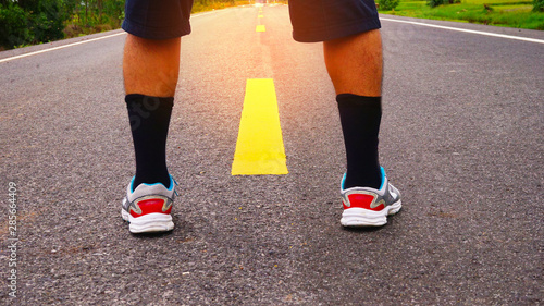 Close up of man with shoe on road.Concept of start.