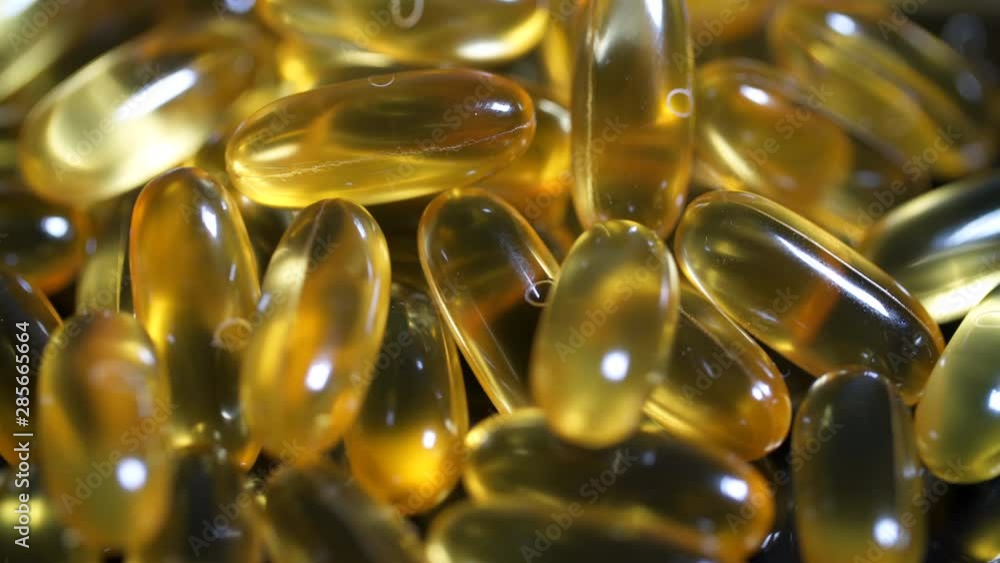 Cod liver oil medicines. Supplement vitamin gel capsule omega 3 close up macro Cod liver oil medicines. Supplement vitamin gel capsule omega 3 close up macro