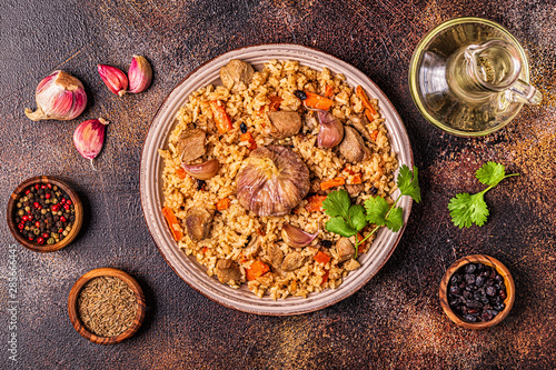Pilaf with meat, vegetables and spices.