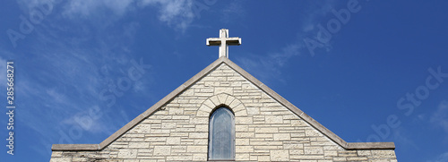 Foto Cross on Church Steeple of Old Christian Stone Temple