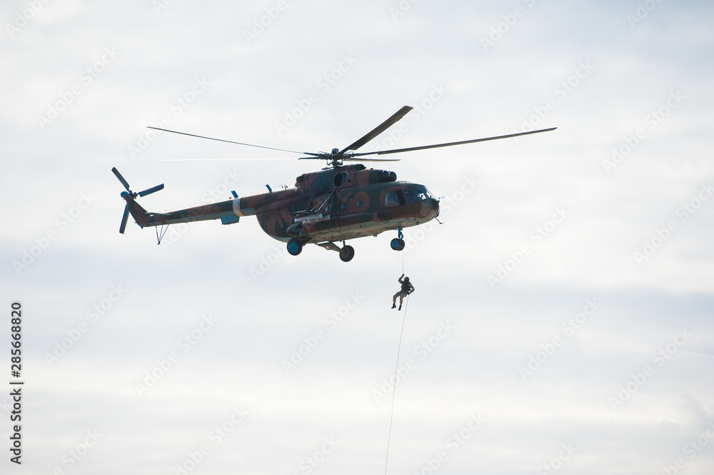 Military helicopter flying during exercise Military helicopter flying during exercise