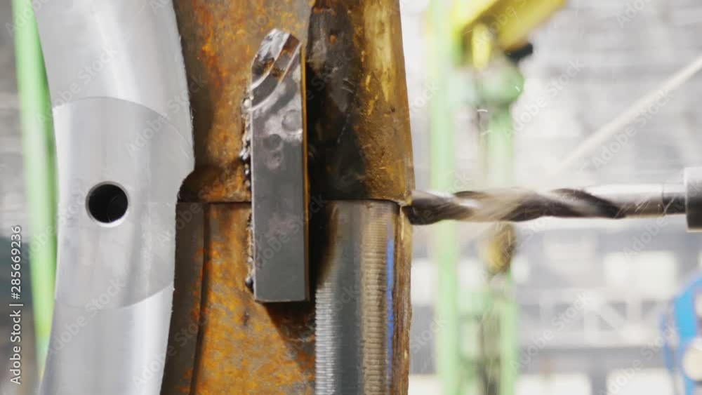 Process of metalworking and machine manufacturing of press form. Tool cut and drill molds with coolant. Close up. Milling machine produces metal detail on factory. Machining of machine parts Process of metalworking and machine manufacturing of press form. Tool cut and drill molds with coolant. Close up. Milling machine produces metal detail on factory. Machining of machine parts