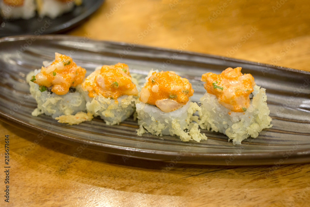 A piece of california roll, focus selective. A piece of california roll, focus selective.