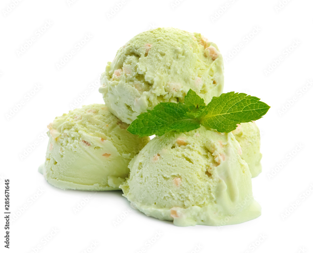 Scoops of delicious pistachio ice cream with mint on white background Scoops of delicious pistachio ice cream with mint on white background