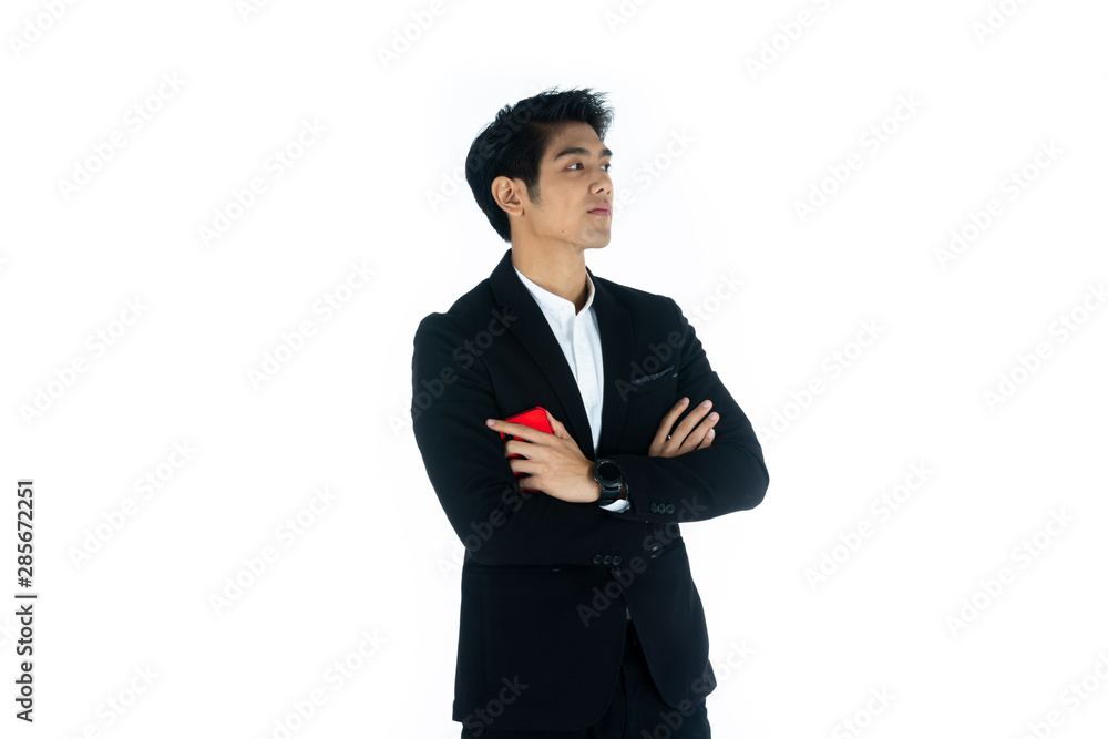 Handsome young businessman Asian caucasian wear a black suit with black hair, be a smile and standing smart poses. Hold and use a smartphone. On white background. Handsome young businessman Asian caucasian wear a black suit with black hair, be a smile and standing smart poses. Hold and use a smartphone. On white background.
