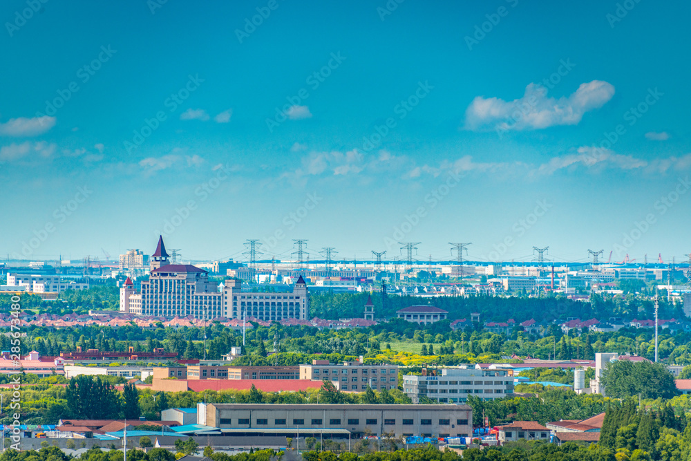 Fototapeta premium Industrial factories and nearby homes in Shanghai, China
