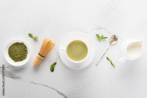 flat lay with green matcha tea on white table