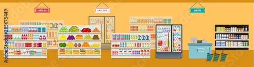 The interior of a grocery supermarket and store with shelves and products.