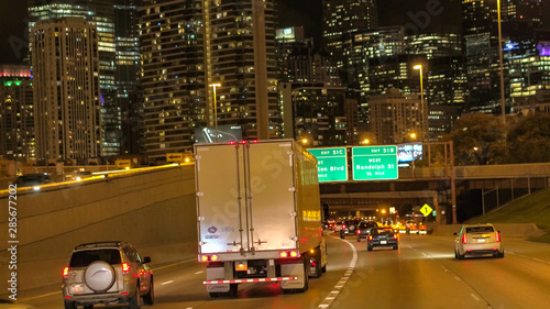 FPV Driving along the underpass at night on busy interstate highway full of cars