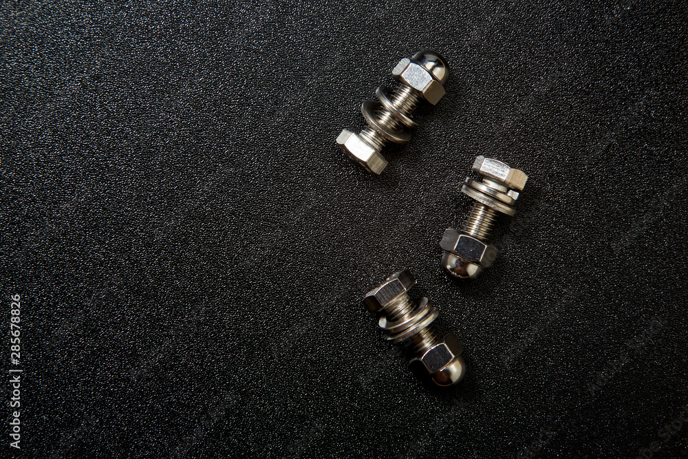 Bolt and nut on black background Bolt and nut on black background