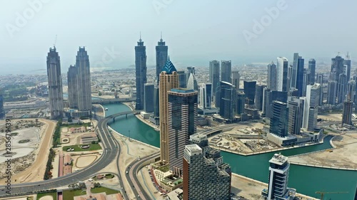 Drone flyover above downtown Dubai, UAE. Aerial view on skyscrapers.