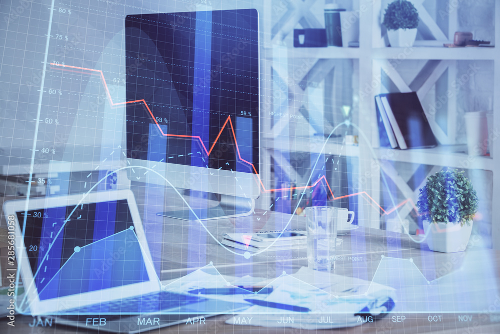Financial market graph hologram and personal computer on background. Double exposure. Concept of forex. Financial market graph hologram and personal computer on background. Double exposure. Concept of forex.