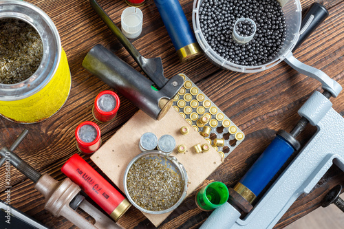 Canvas Print Shotgun shells reloading process with special reload equipment