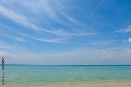 Perfect sky and water of ocean, bokeh sun light wave abstract background. © panadda