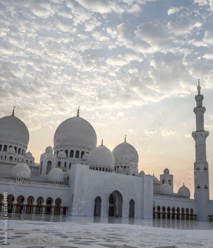 White mosque and blue sky on a summer day in the UAE.