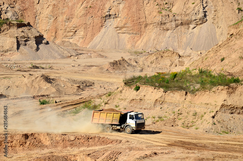 Belarus, Minsk region, open pit sand "Radoshkovichi". Dump truck transports sand and other minerals in the mining quarry.