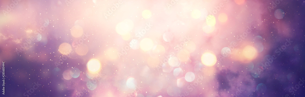 abstract glitter silver, purple, blue and gold lights background. de-focused. banner