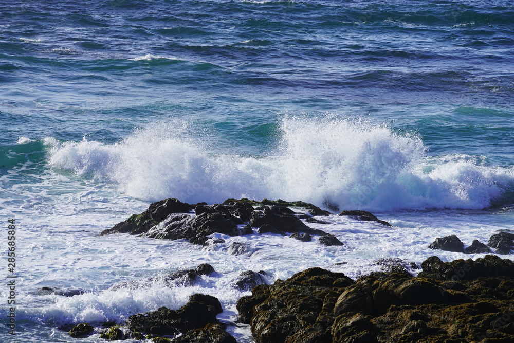 Beautiful coastline scenery with ocean waves and rocks cliff on Pacific Coast, California, US Beautiful coastline scenery with ocean waves and rocks cliff on Pacific Coast, California, US