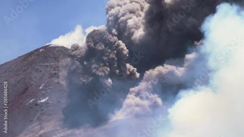 Mount Etna Eruption - Lava flow and ash emission in volcano Etna in Sicily photo