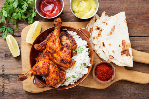 Tandoori chicken with jasmine rice and pita bread, indian cuisine. photo