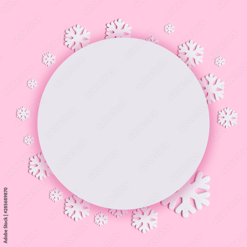 White christmas snowflakes decoration on pink background. White christmas snowflakes decoration on pink background.