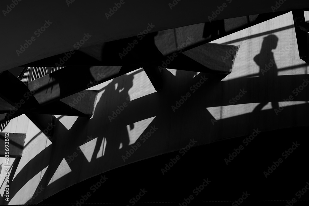Fototapeta premium Shadows on the wall from walking people. Abstraction