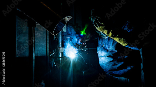 Industrial Worker  laborer at the factory welding