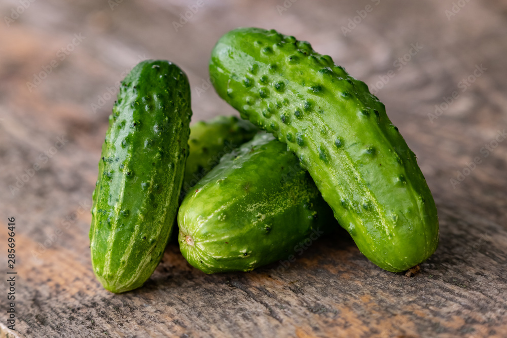 Cucumber sliced on the cutting board, salad ingredient, fresh cucumbers on a table. Cucumber sliced on the cutting board, salad ingredient, fresh cucumbers on a table.