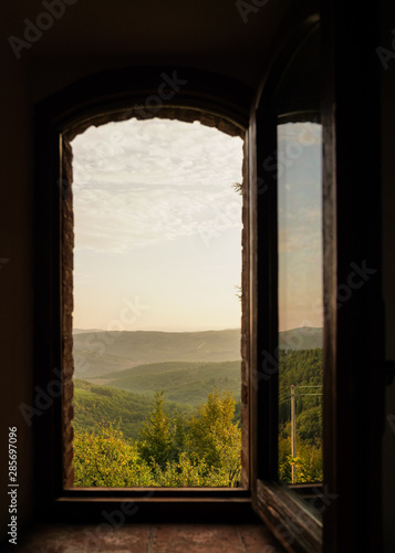 open window on the wall with Italian landscape 